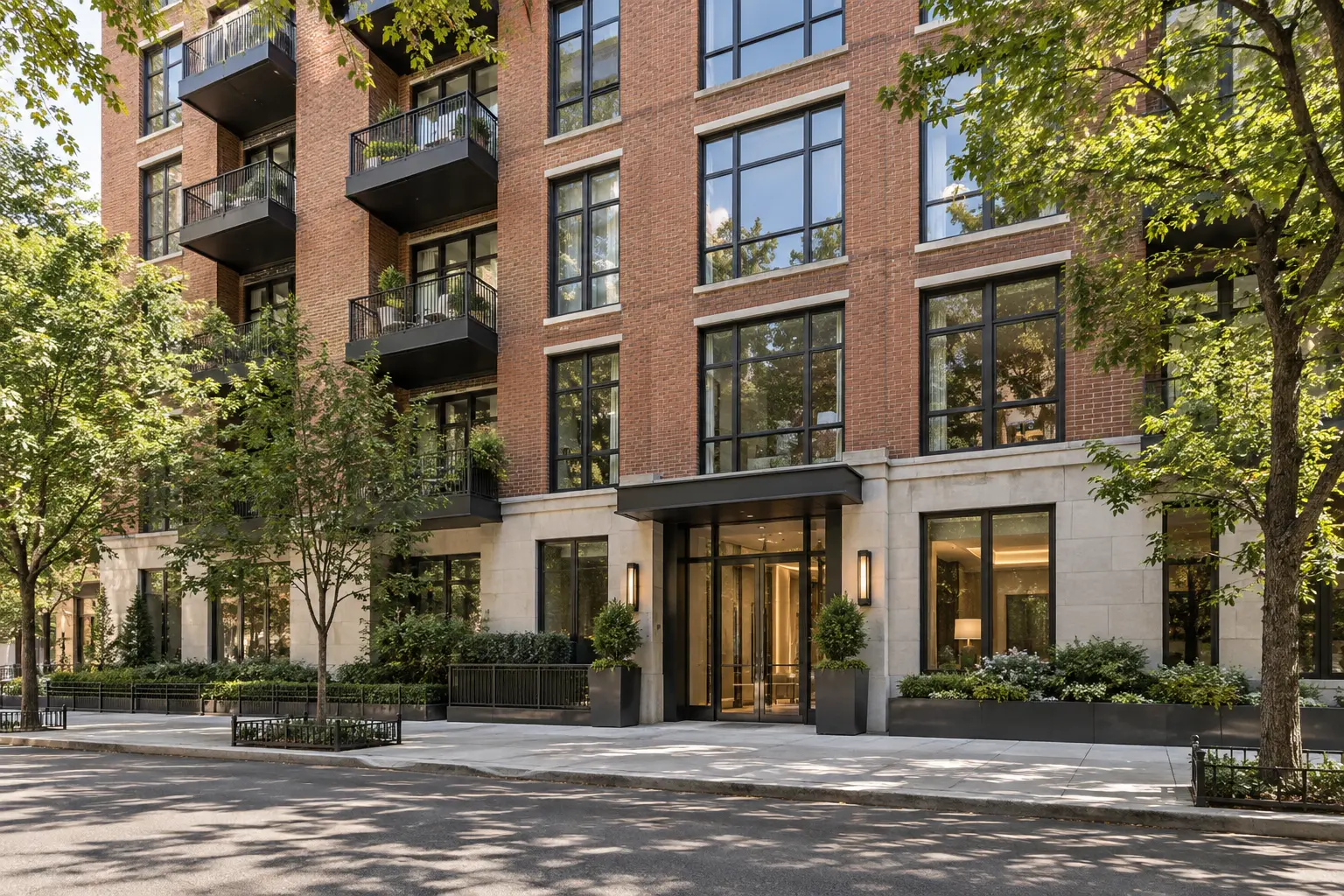 A clean, contemporary residential building exterior on a tree-lined New York City street